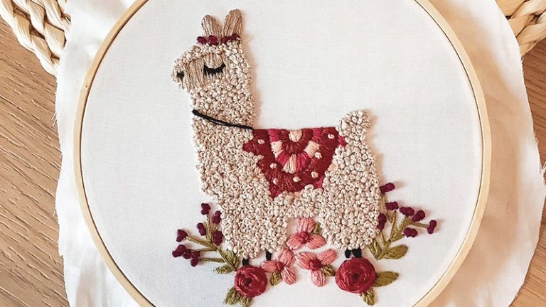Alpaca with embroidered saddle pattern
